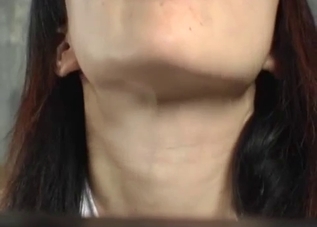 Asian chick in captivity eating worms