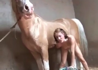 Skinny slut is getting railed by a hung horse
