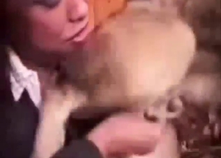 Bestiality sex shows two ladies handling a dog