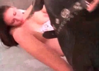 Dark-haired beauty getting banged by a dog